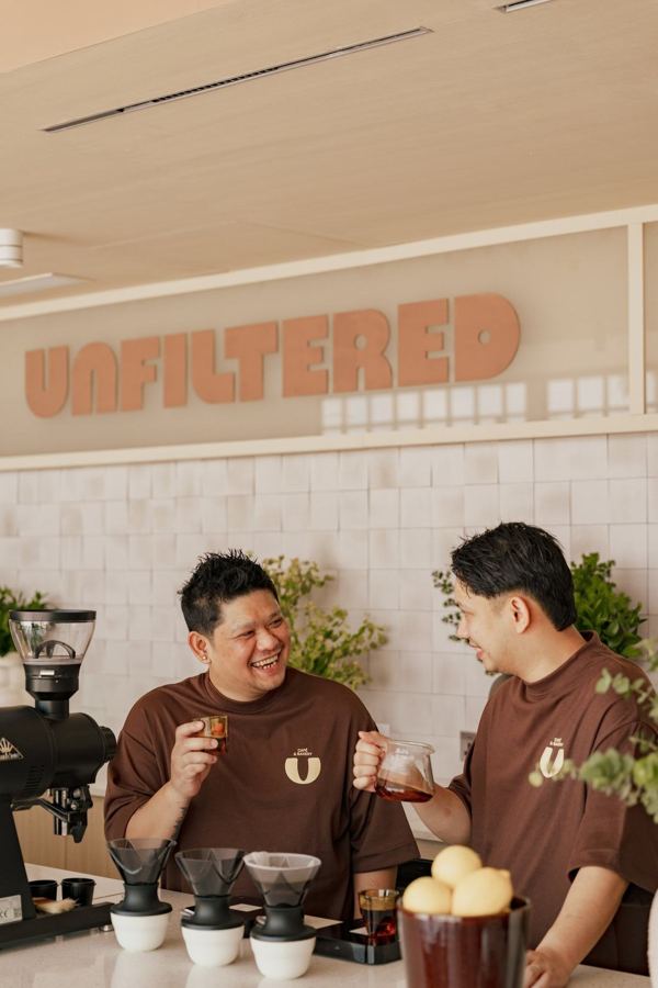 Two baristas at the counter
