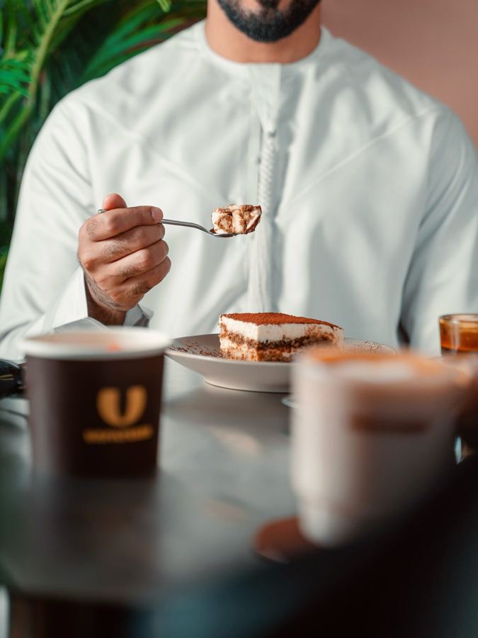 A guest eating tiramisu